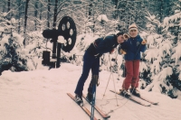 At the age of 16 with his sister on skis