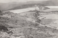 Filling of the Josefův Důl Waterworks Reservoir. The photo shows the side dam and the construction of the operational facilities, around 1981