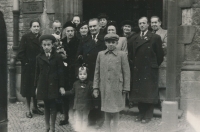 Relatives' wedding; Jarmila Přibylová is at right in the front row with her cousin and brother, 1947