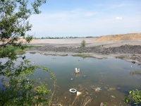Sludge lagoon of the former uranium ore processing plant, viewed from Mydlovary; 2025