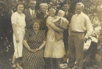 Photographs of Eva Šestáková's extended family, on the right Václav Šesták, Květa Šestáková holding her daughter Eva, Zahájí, 1949