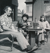 With his father and mother in the early 1970s
