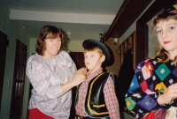 A masquerade; with mother and siblings, 1990s