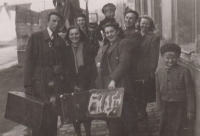 With the theatre troupe; first row, second right with a suitcase, 1950
