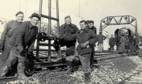 Witness´s father (in the middle, standing on the tracks) with co-workers as a laborer on a construction train, 1955
