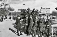 Jan (far left) in a relaxed conversation with friends in France