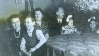 With parents and sisters, 1940s