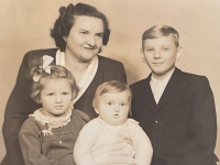 Family photo – mother Antonie Mikesková, brother Stanislav, sister Věra, and youngest brother Tomáš in 1949