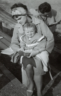 Růžena Hajnová with her eldest son, Petr Hajn reading in the background