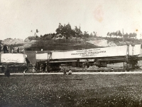 Moving the obelisk by railway via Telč, Jihlava to Prague. It is not clear from the photographs whether this was the first obelisk that broke during its journey. The second one was transported to Prague Castle in 1928.