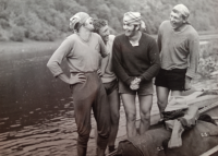 The witness (third from left) with friends on a canoeing trip