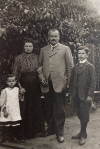 Witness's father (right) with his parents and brother