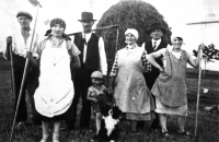 The family of the witness's husband, Jaroslav Strnad in the middle with his dog, on the right his mother Božena Strnadová, around 1932