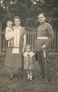 Grandparents of the witness Věnceslava and Josef Truhlář, in the arms of their mother Venda Truhlářová - mother of the witness, 1925