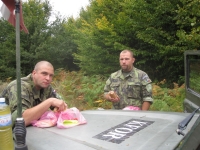 A snack on patrol in Kosovo, Petr Nový on the left, August 2010