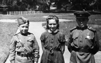 Jitka Havranková's sister Alena with boys in Red Army uniforms in a park in Pečky, likely in May 1945