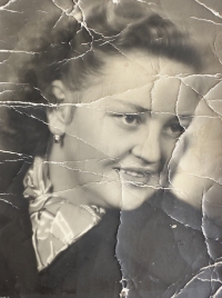 Vlasta Pavlíková during her father's imprisonment. She gave the photograph to him, and he carried it in his pocket all the time, which is why it is damaged. It is precious to Vlasta Pavlíková.