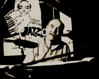 Martin Kratochvíl in Studio Budíkov, behind him the cover of the book Suma sumárum