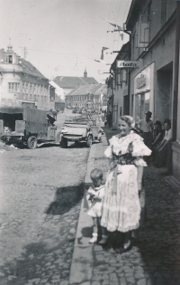 Ludmila Švecová in a South-Bohemia costume with her son Ladislav Dvořák in Golčův Jeníkov on 10 May 1945