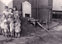 Ludmila Müllerová with children by the shelter, May 1945