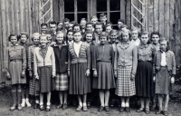 Witness as a girl, fourth from the left, in the 8th grade in front of the municipal school in Stěbořice, 1946