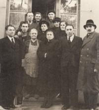 Extended family of M. Kopt (second from the left), his father Karel Kopt (1st from the left), his mother Helena (on the top on the rigth side of the doors)