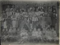 Children from the school in Malín. Mstislav Pospíšil is the first kid from the right side in the second row.