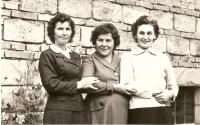 With her sisters in the late 1950s