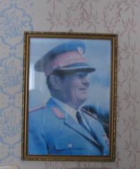 A picture of Josip Broz Tito that's hanging on the wall at the place of the witness