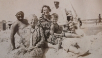 Parents with brother and granny by the sea