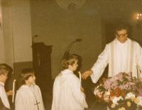Austrian priest Blaze during the baptism of witness' Tomáš