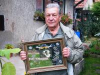 Mr. Václav Hanf holding his wedding photography from 1953