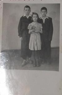 Mr Kevrekidis with sister and brother in Poland