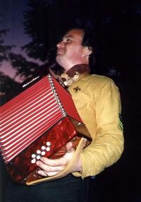 A camp picture - Podolánky in 1994, Mr. Vymětalík is playing the accordion 