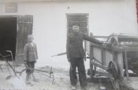 Father Alexander standing in front of his blacksmith shop in Podlísky in 1936