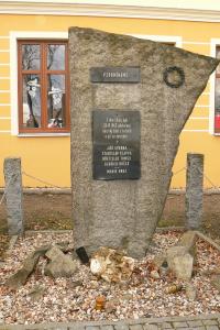 Plaque by the school in Včelákov