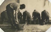 Scrubbing sand: a genre postcard from the pre-war times