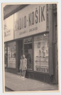 Věra Kocurková - Košíková with her sister in front of their father's radio shop, Prague - Perštýn, during WWII