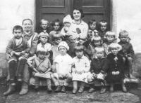 In the kindergarten - front row, 3rd from the right (probably 1934)