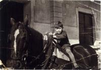 As a child, on horseback