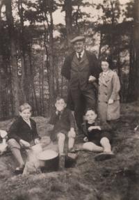 Father with Růžena and brother (sitting, right), 1937