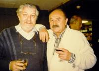 With his friend in 1990s