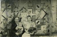 Mykytka’s Family with their five children. Stand: Dauchters Lyubomira and Aniziya. Sit: son Orest, Fr. Markiyan with youngest son Bogdan and Mrs. Maria with son Yuriy. Special settlement Dzhonka, Khabarovsk krai in the Far East of the USSR, 1956. 