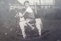 On a rocking horse.