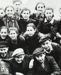 Alžbeta among classmates (in the middle)