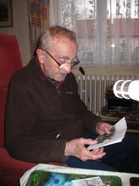 Mr. Piskáček showing photographs during the interview