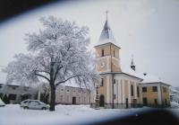 The Church of St. Floriana with the economy of the family Zapletalů in Krčmani
