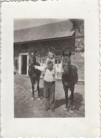 With her daddy and horses, 1944