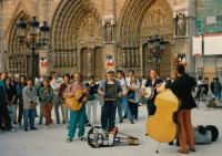 A performance in front of Notre-Dame Cathedral; Pavel Douša is on the right, holding the banjo, 1990s