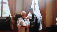 Helena receiving the German Order of Merit with a Ribbon from Horst Kohler in 2006
